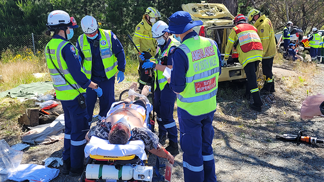 Paramedic Interns treating dummy patients at the Queanbeyan Multi Agency Training Exercise on 18 November 2022Fire and Rescue NSW officer treating dummy patients in a road crash training exercise near Queanbeyan on 18 November 2022.