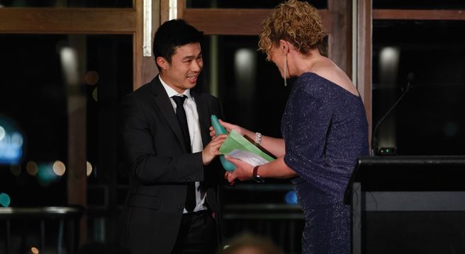 Nam Le receiving CAA Award of Excellence 